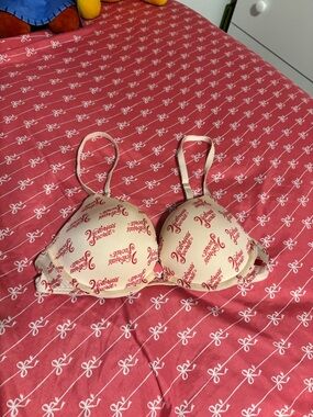 Victoria's Secret pink Bra with Red Logo Pattern